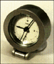 [It's a clock.  The universal symbol of time.  Well maybe not universal, but at least in America.  In Canada?  Nope.  Probably not.]
