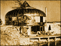 [This photo harkens back to the yester year, with golden hues and odd architecture.]