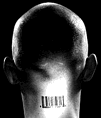 [This is a picture of a guy with a upc code on the back of his head.  I wonder, if he were to stand really close to a supermarket checkout line, would he come up as a product ening in a .99  or a .00?]