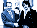 [This is elvis.  And here he stands with Nixon.  I hear they are very happy on that island with Jim Morrison.]