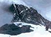 [Photograph of one of the tallest peaks on Earth. It's actually any snowcapped mountaintop, but it sounds more dramatic if you exaggerate. And it's probably no exaggeration. If I had the time to go and check, it would probably turn out to be the top of Mt. Everest for all I know.]